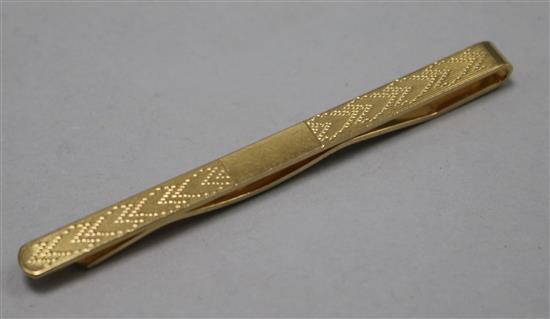 A 9ct gold tie clip.